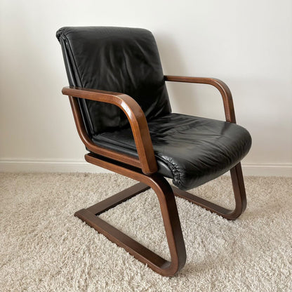 Fauteuil vintage cuir et bois